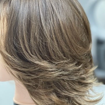 Precise match to client's hair before total hair loss due to chemotherapy treatment.  Medical wig for ultra sensitive skin.